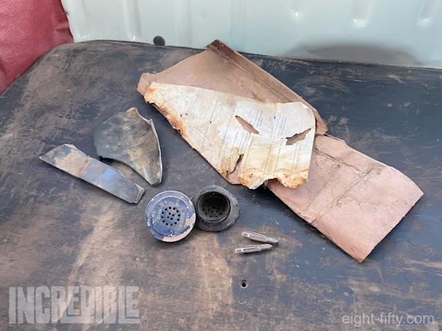 Broken pieces of phones and equipment, along with paperwork, gave evidence to the car’s working life.