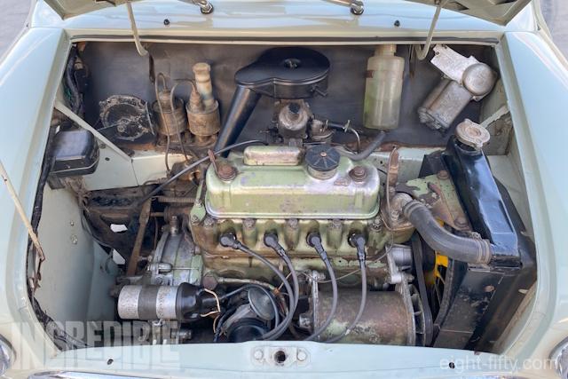 The engine bay is original, retaining the factory paint on the body and engine.